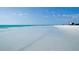 Wide sandy beach with clear water and a vibrant coastline on a clear day at 1249 Dockside Pl # 110, Sarasota, FL 34242