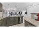 Modern kitchen with granite counters and stainless steel appliances; open to the living room at 1249 Dockside Pl # 110, Sarasota, FL 34242