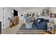 Open-concept living room with modern furnishings, seamless flow to kitchen, and bright natural light at 1249 Dockside Pl # 110, Sarasota, FL 34242