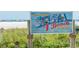 Welcome sign to world renowned Siesta Key Beach at 1249 Dockside Pl # 110, Sarasota, FL 34242