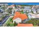 Aerial view of a beautiful residential neighborhood with well-maintained lawns and stunning water views at 12622 Safe Harbour Dr, Cortez, FL 34215