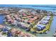 Beautiful waterfront community with red tile roofs and boat docks on canals leading to the open bay at 12622 Safe Harbour Dr, Cortez, FL 34215