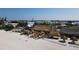Beachside tiki restaurant with colorful umbrellas and thatched roof offering a tropical dining experience at 12622 Safe Harbour Dr, Cortez, FL 34215