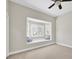 This room is equipped with neutral carpet and a bay window with views outside at 12622 Safe Harbour Dr, Cortez, FL 34215