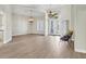 Bright foyer featuring soaring ceilings, decorative chandeliers, and elegant double doors at 12622 Safe Harbour Dr, Cortez, FL 34215