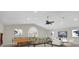 Spacious game room featuring a pool table, foosball, comfortable seating, and large screen TV at 12622 Safe Harbour Dr, Cortez, FL 34215