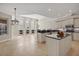 Open concept kitchen with natural light, stone countertops and stainless steel appliances at 12622 Safe Harbour Dr, Cortez, FL 34215