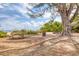 Shaded picnic area with tables and a trash receptacle near the beach at 12622 Safe Harbour Dr, Cortez, FL 34215