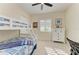 Bright bedroom with a bunk bed, a white dresser, and a shuttered window at 13630 Deep Blue Pl, Bradenton, FL 34211
