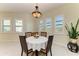 Cozy breakfast nook with plantation shutters and a decorative light fixture at 13630 Deep Blue Pl, Bradenton, FL 34211