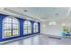 Bright exercise room with large windows, offering abundant natural light and space for a home gym at 13630 Deep Blue Pl, Bradenton, FL 34211
