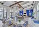 Elegant clubhouse lounge with high ceilings, fireplace, ceiling fans, and ample seating areas at 13630 Deep Blue Pl, Bradenton, FL 34211
