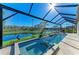 Backyard pool and spa overlooks a tranquil pond in a screened-in enclosure at 13630 Deep Blue Pl, Bradenton, FL 34211