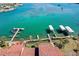 Stunning aerial view of waterfront property with private docks on clear turquoise waters at 1760 Gulf Blvd # 603, Englewood, FL 34223