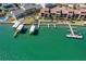 Beautiful aerial shot of waterfront condos with private boat docks on tranquil, emerald waters at 1760 Gulf Blvd # 603, Englewood, FL 34223