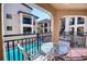Balcony with seating area overlooking a sparkling community pool at 1760 Gulf Blvd # 603, Englewood, FL 34223