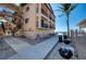 Multi-story building exterior with beach access, outdoor seating, and grills at 1760 Gulf Blvd # 603, Englewood, FL 34223
