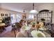 Inviting living room and dining area with sliding glass doors to private balcony at 1760 Gulf Blvd # 603, Englewood, FL 34223