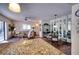 Open concept living and dining area with access to balcony, comfortable seating and modern design at 1760 Gulf Blvd # 603, Englewood, FL 34223