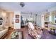 Cozy living room featuring comfortable seating, carpet, and plenty of natural light at 1760 Gulf Blvd # 603, Englewood, FL 34223