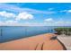 Spacious backyard area with a wooden deck, with a tranquil ocean view creating a peaceful retreat at 204 N Washington Dr, Sarasota, FL 34236