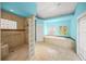 Bright primary bathroom with a walk-in shower, tub, and blue accents creating a refreshing space at 204 N Washington Dr, Sarasota, FL 34236