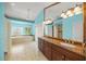 Luxurious primary bathroom with double vanity, marble counters, a soaking tub, and a separate shower at 204 N Washington Dr, Sarasota, FL 34236