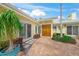 Charming home entrance with double doors, large windows, and beautifully manicured landscaping at 204 N Washington Dr, Sarasota, FL 34236