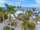 Beautiful waterfront home with tropical landscaping, pool, updated white roof and paver driveway at 204 N Washington Dr, Sarasota, FL 34236