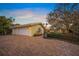 Charming home with lush landscaping, a brick driveway, and a welcoming entryway at 204 N Washington Dr, Sarasota, FL 34236