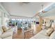 Bright living room with a fireplace, stylish furnishings, and panoramic waterfront views at 204 N Washington Dr, Sarasota, FL 34236