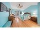 Tranquil primary bedroom with hardwood floors, a cozy sitting area, and a large window for natural light at 204 N Washington Dr, Sarasota, FL 34236