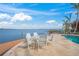 Enjoy outdoor dining with a view with poolside seating on the patio near the ocean at 204 N Washington Dr, Sarasota, FL 34236