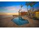 Private pool and lounge area offering serene waterfront views at sunset at 204 N Washington Dr, Sarasota, FL 34236