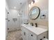 Modern bathroom featuring a vanity, stylish mirror, glass enclosed shower, and modern fixtures at 211 81St St # B, Holmes Beach, FL 34217