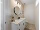 Bathroom featuring a single vanity, stylish mirror and decor, and modern fixtures at 211 81St St # B, Holmes Beach, FL 34217