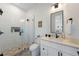 Bright bathroom with a glass shower, white cabinets, quartz countertop, and stylish patterned tile flooring at 211 81St St # B, Holmes Beach, FL 34217