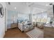 Spacious bedroom with vaulted ceilings, shiplap accent wall, sitting area, and a ceiling fan at 211 81St St # B, Holmes Beach, FL 34217