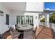 Outdoor deck with a table, chairs, and beautiful views of the home's property at 211 81St St # B, Holmes Beach, FL 34217