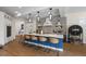 Modern open-concept kitchen featuring seating at the island and tiled backsplash at 211 81St St # B, Holmes Beach, FL 34217