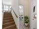 Stairway to second floor with view to laundry room with washer and dryer at 211 81St St # B, Holmes Beach, FL 34217
