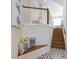 Stairway with wood stairs and bench seating with decorative pillows at 211 81St St # B, Holmes Beach, FL 34217