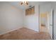 Bedroom with carpet and a closet that is adjacent to an open doorway leading to another room at 2260 Island Creek Rd, Sarasota, FL 34240