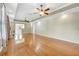 Living room with hardwood floors, a cozy fireplace, and ample natural light coming in from a large window at 2635 Arnold St, Sarasota, FL 34231