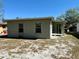 View of the house's backyard showing the exterior wall and windows at 3035 Pershing Ave, Sarasota, FL 34234