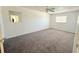 Comfortable bedroom with carpet and ample natural light at 3035 Pershing Ave, Sarasota, FL 34234