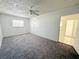 Cozy bedroom with neutral walls and carpet flooring at 3035 Pershing Ave, Sarasota, FL 34234