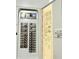 Image shows the house's electric panel, breaker box, and labels at 3035 Pershing Ave, Sarasota, FL 34234