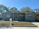 Charming single-story home with a well-maintained front yard and inviting curb appeal at 3035 Pershing Ave, Sarasota, FL 34234