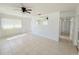 Spacious living room with neutral colors and a hallway leading to bedrooms at 3035 Pershing Ave, Sarasota, FL 34234